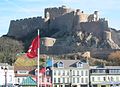 Mont Orgueil with flags.jpg